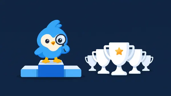 Pip, the blue bird mascot, on a small podium beside a row of white trophy cups of different heights, one cup with a tiny amber star