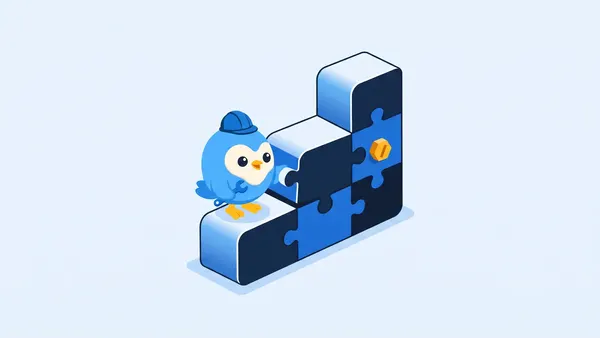 Pip, the blue bird mascot, wearing a hard hat and fitting the last blue puzzle piece into a stepped block structure on a pale blue background