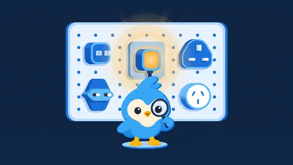 Pip, the blue bird mascot, in front of five different plug adapters on a pegboard, one plugged in and glowing